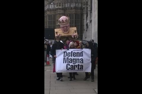 Grayling effigy being taken to Global Law Summit